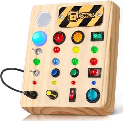 The Valga Montessori LED Busy Board is a Montessori-inspired wooden activity board designed for early development. It features various buttons, switches, and knobs, including colored lights, a dial, and multiple switches of different shapes and sizes. This interactive busy board also prominently displays a "Power" label on the top right corner.