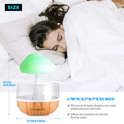 A woman sleeps peacefully on her bed, surrounded by a soothing atmosphere created by the Valga Desktop Rain Cloud Humidifier. With its wooden base and dimensions of 6.7 x 6.7 x 9.53 inches, it gently diffuses essential oils while producing the calming sound of water droplets.