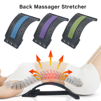 A person lying on their back uses the Valga Back Massage Pad, with graphical illustrations showing the lumbar spine’s alignment and red heat waves indicating relief. Above them are three different models of the massage pad, colored blue, purple, and green. Text reads "Valga Back Massage Pad.”