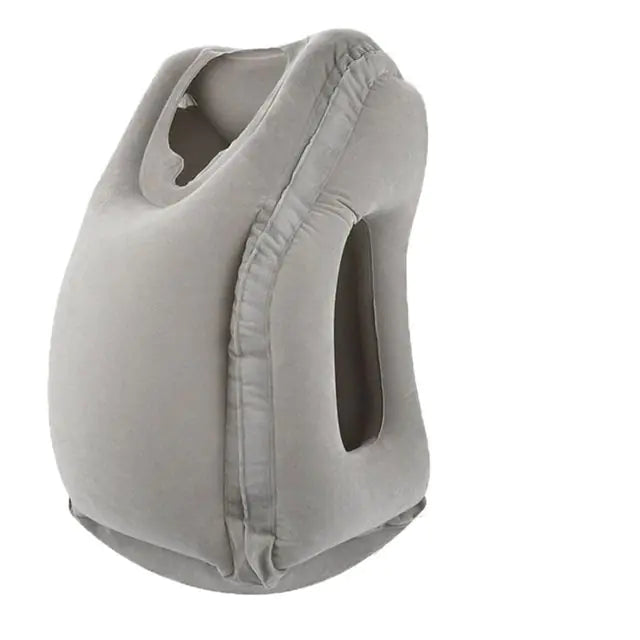 The Valga Inflatable Air Cushion Travel Pillow in gray is designed for comfort with its unique inflatable structure. It features armholes and a face hole, allowing users to lean forward and rest their head and arms comfortably. The pillow's ergonomic design provides neck pain relief and serves as a compact travel accessory.