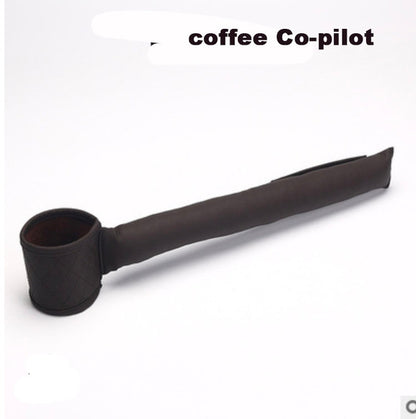 This black cylindrical item, called the "Leather Car Seat Gap Filler" by Valga, is designed to keep a coffee cup secure. It features a padded PU leather sleeve that extends to a point for resting on surfaces and has a holder at one end. The quilted holder end resembles the texture of leather car seat gap fillers.