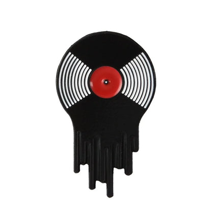 The Punk Music Lovers Enamel Pin by Valga is designed for punk aficionados, featuring an old vinyl record melting from its bottom edge. Its black and white striped circular design with a red center offers a vintage aesthetic blended with a modern, artistic twist that pays tribute to the punk movement.