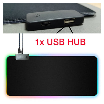 An image displaying two parts. The top section shows a close-up of a black USB Hub with ports. The bottom section features a large, rectangular RGB Mouse Pad with multi-colored LED lighting around the edges, branded as Valga's "RGB Mouse Pad with Cable," and the USB hub connected at the top-left corner. The text "1x USB HUB" is in red in the center.