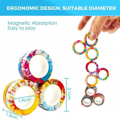 Three colorful magnetic rings from Valga's 3Pcs Magnetic Rings Anti-Stress set are shown in a stack, with one hand holding additional rings to demonstrate their magnetic absorption. Resembling a fidget spinner, the rings measure 1.9cm and 1.3cm in diameter and stand at 3.1cm in height. Text reads "Ergonomic design, suitable diameter. Magnetic absorption easy to play.