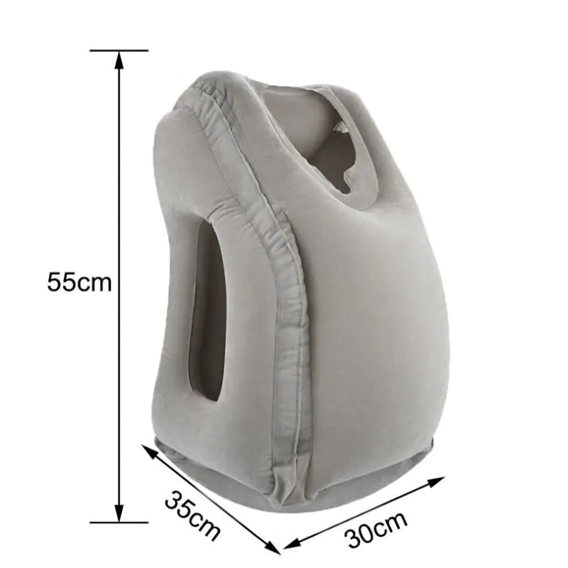 The Valga Inflatable Air Cushion Travel Pillow is a grey, compact travel accessory with a unique ergonomic design. It features arm holes on either side and a face cradle for neck pain relief. The dimensions are 55cm tall, 35cm wide, and 30cm deep.