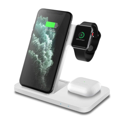 A white Valga 3in1 Wireless Fast Charger Dock Station is shown. It is the perfect multiple device charging solution, powering a smartphone, a smartwatch, and a pair of wireless earbuds. The smartphone shows an 83% charged green battery icon, while the smartwatch displays a 65% charged green battery icon.