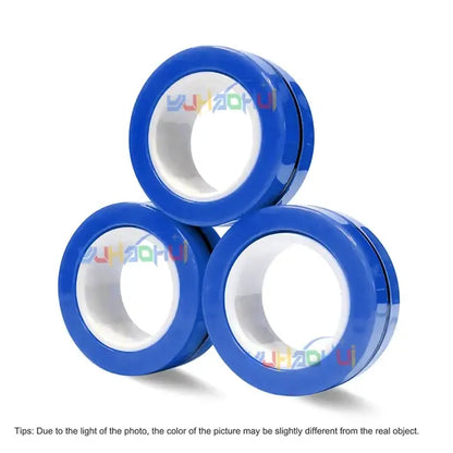 Three pieces of Valga's Magnetic Rings Anti-Stress toy are stacked in a pyramid formation on a white background. With the calming appeal akin to that of an anti-stress fidget spinner, this image also features a cautionary note at the bottom, indicating that the photo's color might differ slightly from the actual product.