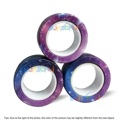 Three **Valga 3Pcs Magnetic Rings Anti-Stress** toys are arranged in a pyramid shape, reminiscent of soothing objects like a fidget spinner. They primarily feature shades of purple, blue, and white. The website name "UHAOHUI" is watermarked over the image, with a note about potential color variation below.