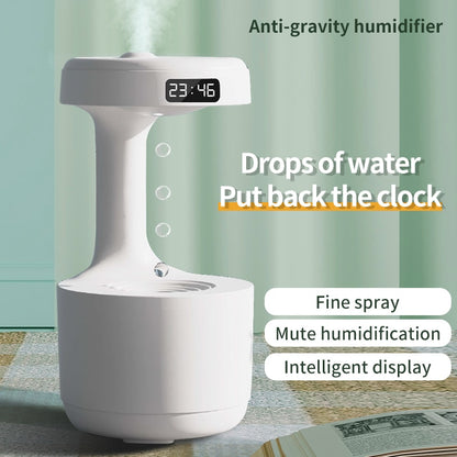 A white **Valga LED Water Drop Humidifier Diffuser** emitting a fine mist is shown in front of a green background. The device displays the time "23:46" with its LED clock display. Text reads "Drops of water Put back the clock" alongside feature highlights: fine spray, whisper-quiet technology, and intelligent display.