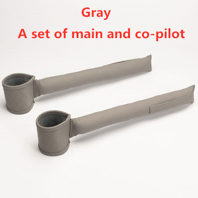 A set of two gray Valga Leather Car Seat Gap Fillers, designed to fit between the main and co-pilot seats. The organizers feature cylindrical cup holder sections and long padded extensions, as depicted in the image.