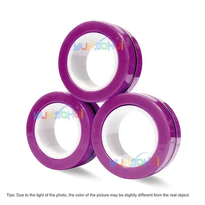 Three stacked rolls of Valga's vibrant purple tape, reminiscent of the 3Pcs Magnetic Rings Anti-Stress product, are displayed against a white background. The rolls have white interiors and are arranged in a triangle formation, with two at the base and one on top. There is text along the bottom cautioning about potential color differences.