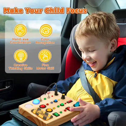 A child wearing a yellow jacket sits in a car seat, smiling and playing with the Valga Montessori LED Busy Board, which features colorful buttons and switches. The image includes text detailing the toy's benefits, such as improving hand-eye coordination, color recognition, and fine motor skills.